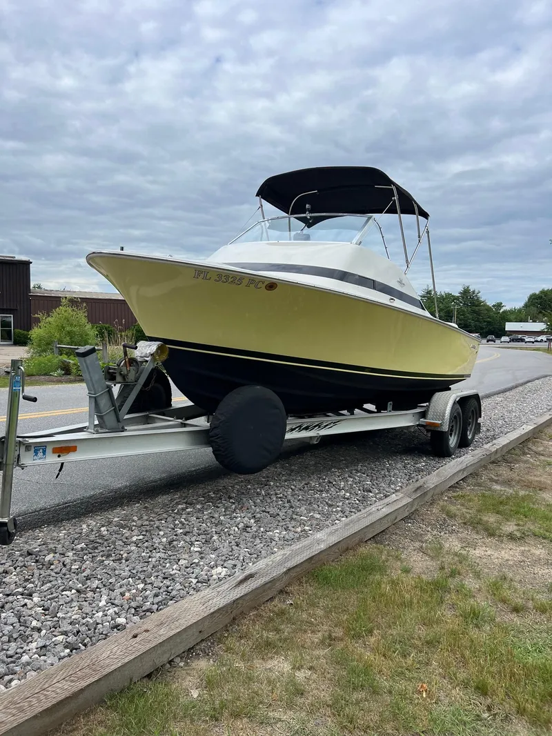 Slide: The Image of 1969 Bertram Bahia Mar 20 boat on a trailer with a black canopy. - 16
