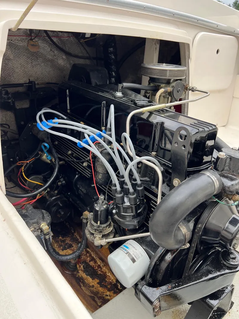 Slide: The Image of 1969 Bertram Bahia Mar 20 boat engine compartment with visible wiring and components. - 5