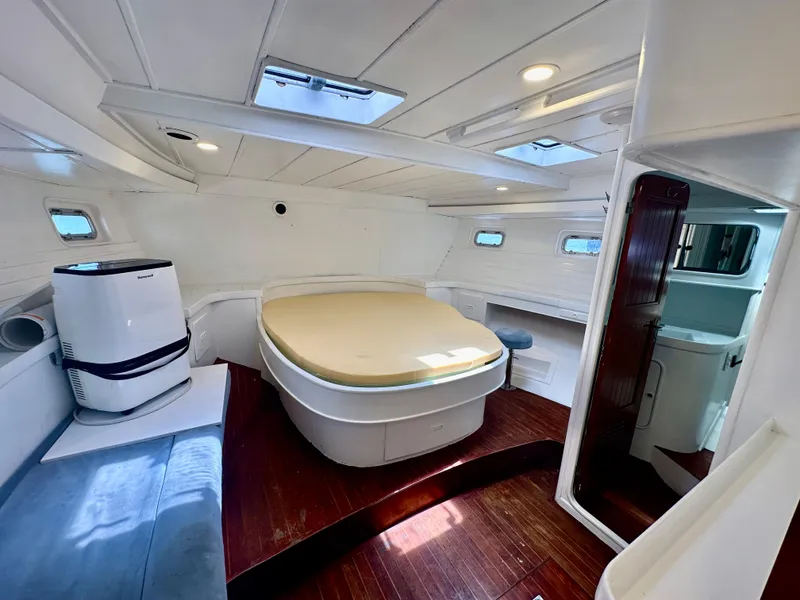 Slide: The Image of Interior of 1983 Tayana 55 yacht with modern furnishings and natural light. - 29