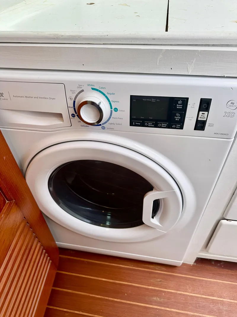 Slide: The Image of Washing machine on a Tayana 55 yacht, 1983 model, with wooden flooring. - 33