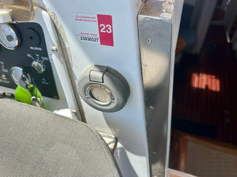 Slide: The Image of Control panel of a 1983 Tayana 55 yacht with ignition switch and customs sticker. - 40