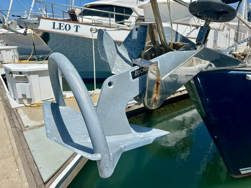Slide: The Image of Anchor on 1983 Tayana 55 sailboat docked at marina. - 41