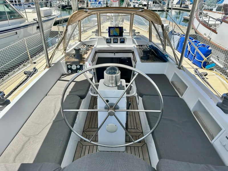 Slide: The Image of Cockpit of 1983 Tayana 55 sailboat with steering wheel and navigation equipment. - 7