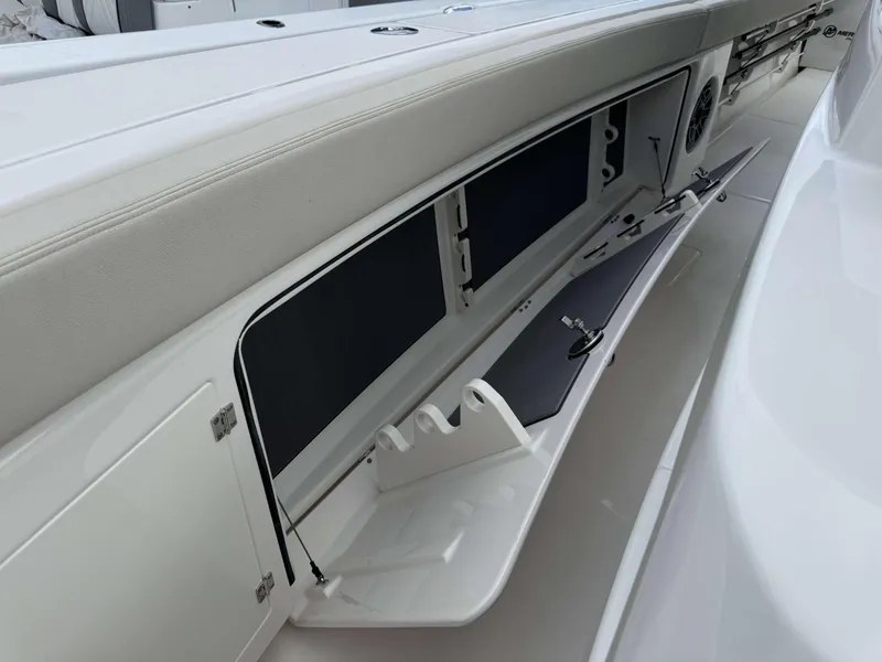 Slide: The Image of Storage compartment of the 2025 Solace 41 CS boat with open hatch. - 17