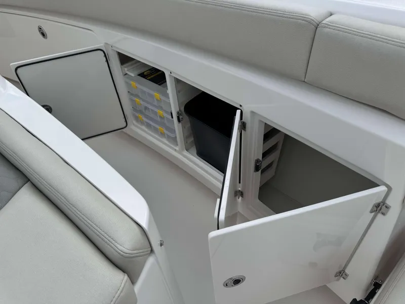 Slide: The Image of Storage compartments on the 2025 Solace 41 CS boat with cushioned seating. - 18