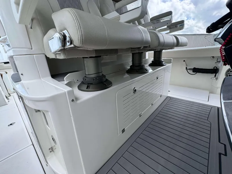 Slide: The Image of 2025 Solace 41 CS boat interior with cushioned seats and storage compartments - 24