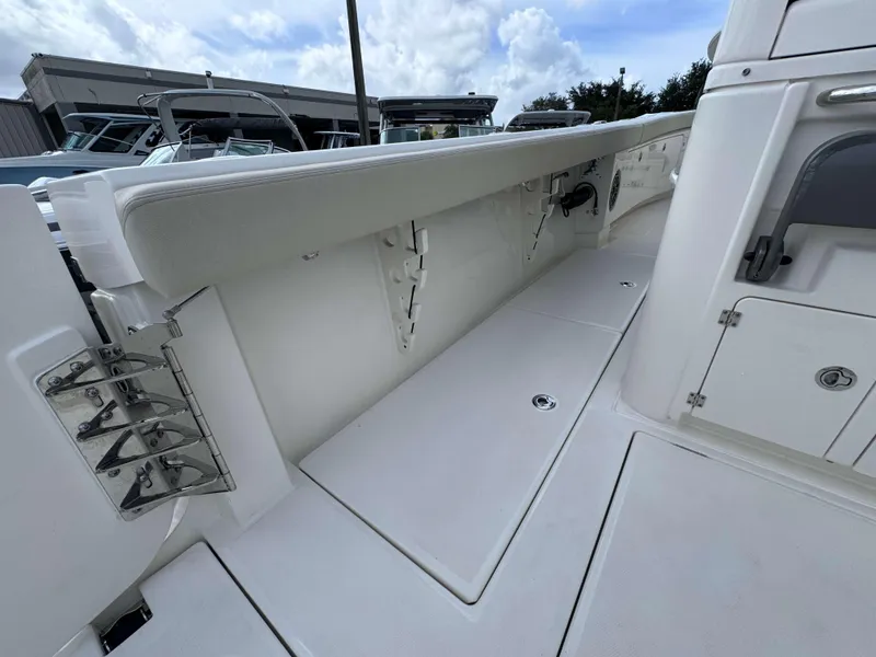 Slide: The Image of 2025 Solace 41 CS boat interior with storage compartments and cushioned seating. - 29