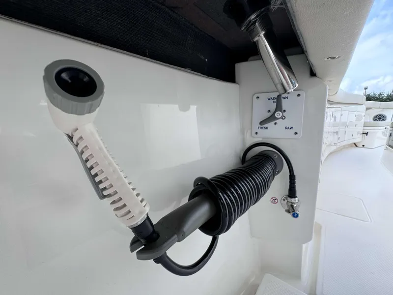 Slide: The Image of Washdown hose and control panel on a 2025 Solace 41 CS boat. - 31