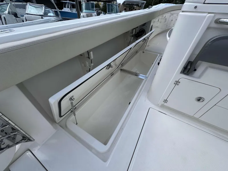 Slide: The Image of Open storage compartment on the 2025 Solace 41 CS boat. - 37