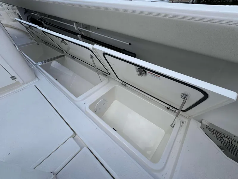 Slide: The Image of Open storage compartments on the 2025 Solace 41 CS boat. - 38