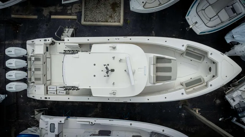 Slide: The Image of Aerial view of a 2025 Solace 41 CS boat with quad outboard engines. - 4