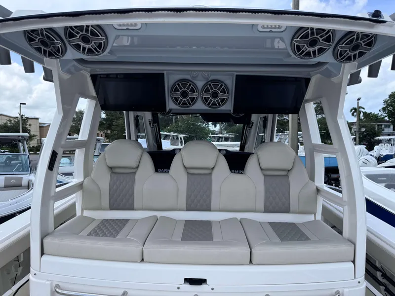 Slide: The Image of 2025 Solace 41 CS boat interior with cushioned seating and overhead speakers. - 40