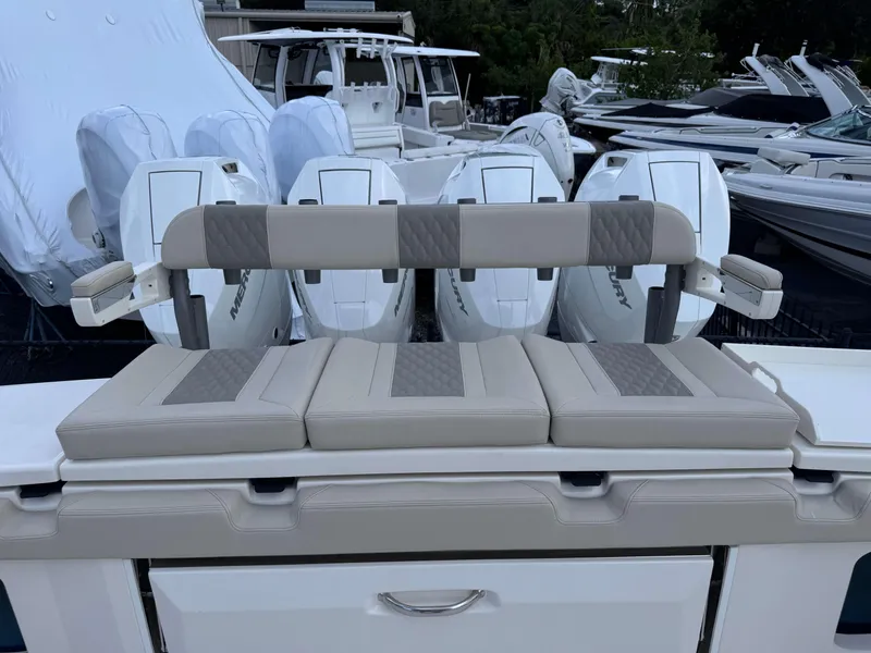Slide: The Image of Solace 41 CS 2025 boat with cushioned seating and Mercury outboard engines. - 42