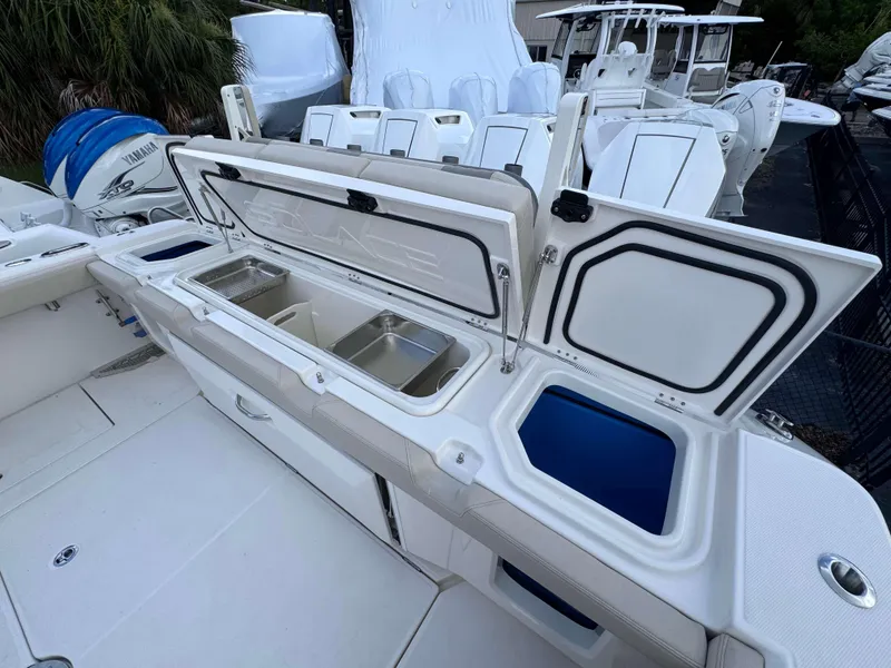 Slide: The Image of Solace 41 CS 2025 model boat with open storage compartments and Yamaha outboard motor. - 45