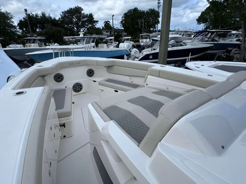 Slide: The Image of Interior view of 2025 Solace 41 CS boat with cushioned seating and storage compartments. - 6