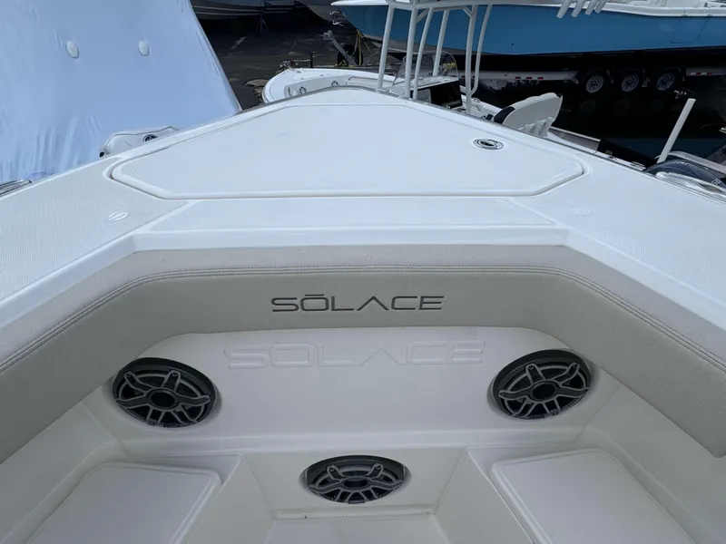 Slide: The Image of Solace 41 CS 2025 boat interior with logo and speakers. - 7