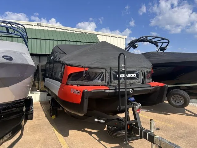 Slide: The Image of 2024 Sea-Doo Switch Sport 21 with cover on trailer. - 13