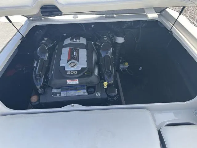 Slide: The Image of 2020 Stingray 208LR boat engine compartment with 200 horsepower engine. - 9