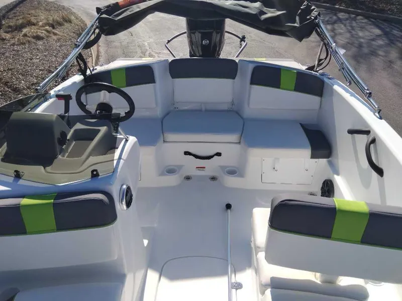 Slide: The Image of 2024 Tahoe T16 boat interior with seating and steering wheel, featuring modern design elements. - 5