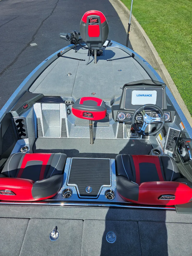 Slide: The Image of 2024 Ranger Z519 Ranger Cup Equipped boat interior with red and black seats and Lowrance electronics. - 2