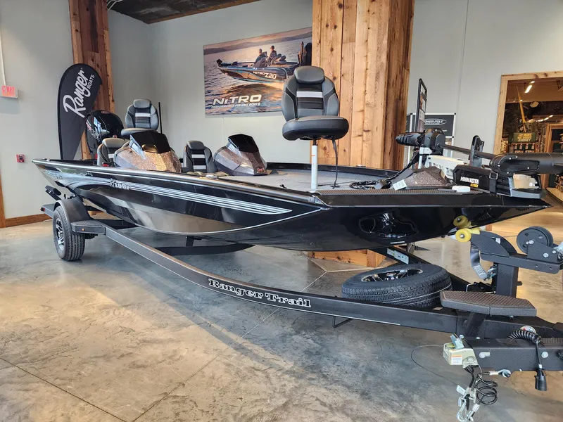 Slide: The Image of 2024 Ranger RT198P bass boat on display in showroom. - 2