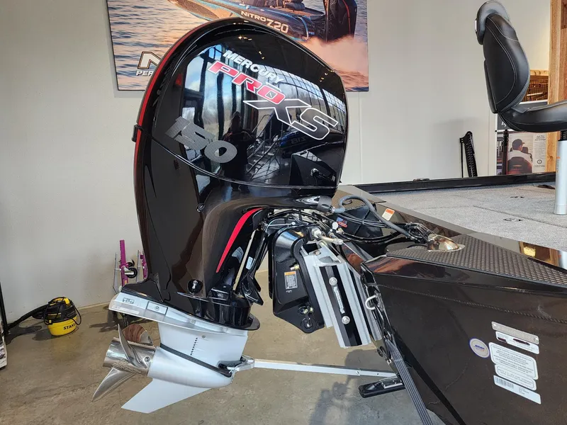 Slide: The Image of 2024 Ranger RT198P boat with Mercury Pro XS outboard motor in showroom. - 4