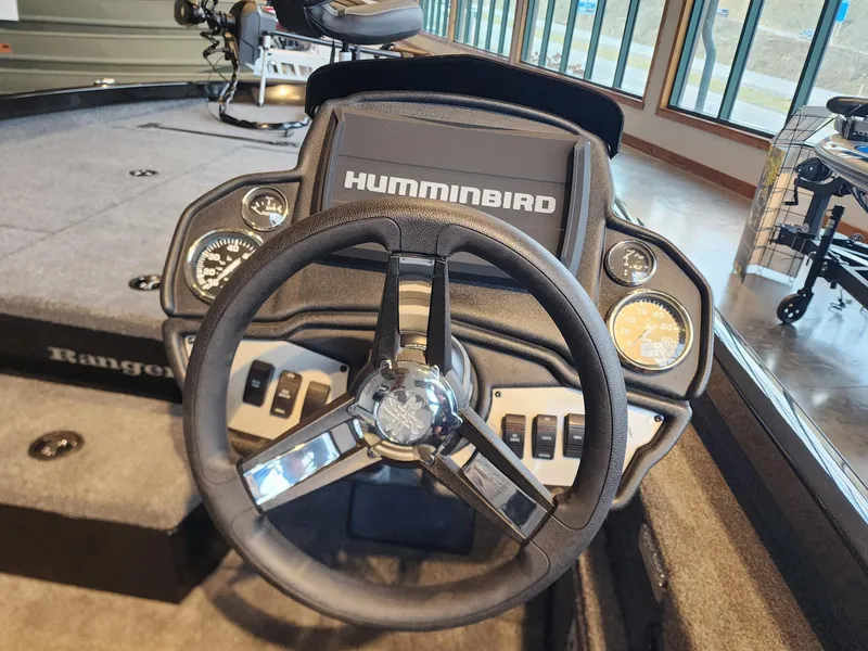 Slide: The Image of 2024 Ranger RT198P boat dashboard with Humminbird electronics and steering wheel. - 7
