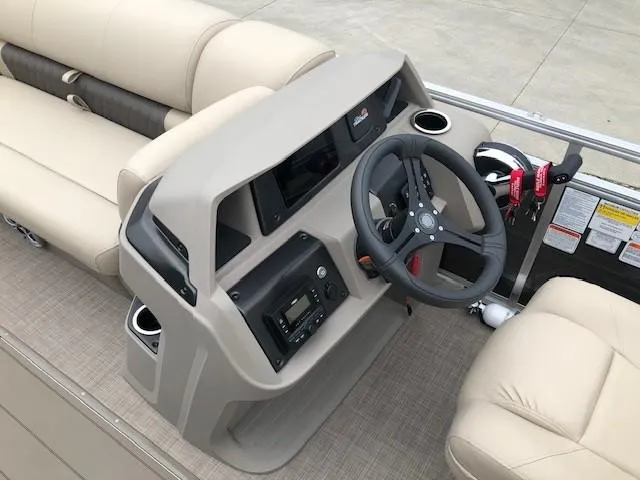 Slide: The Image of 2024 Sun Tracker Party Barge 22 XP3 helm with steering wheel and control panel. - 19