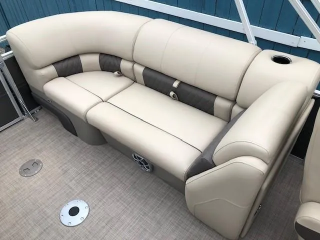 Slide: The Image of 2024 Sun Tracker Party Barge 22 XP3 beige and brown cushioned seating area. - 24