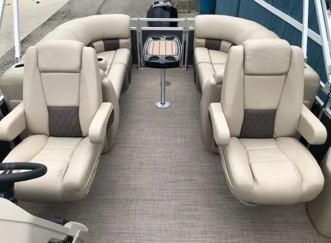 Slide: The Image of 2024 Sun Tracker Party Barge 22 XP3 interior with beige seating and table. - 28