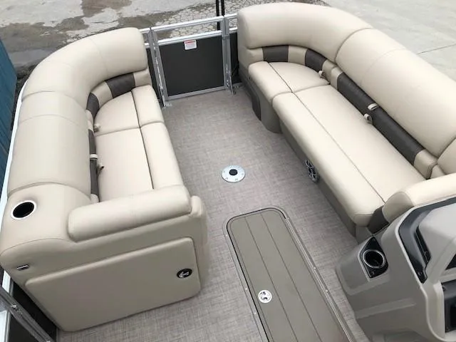 Slide: The Image of 2024 Sun Tracker Party Barge 22 XP3 interior with beige seating and spacious layout. - 7