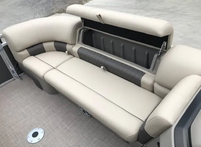 Slide: The Image of 2024 Sun Tracker Party Barge 22 XP3, beige seating with storage compartment. - 9