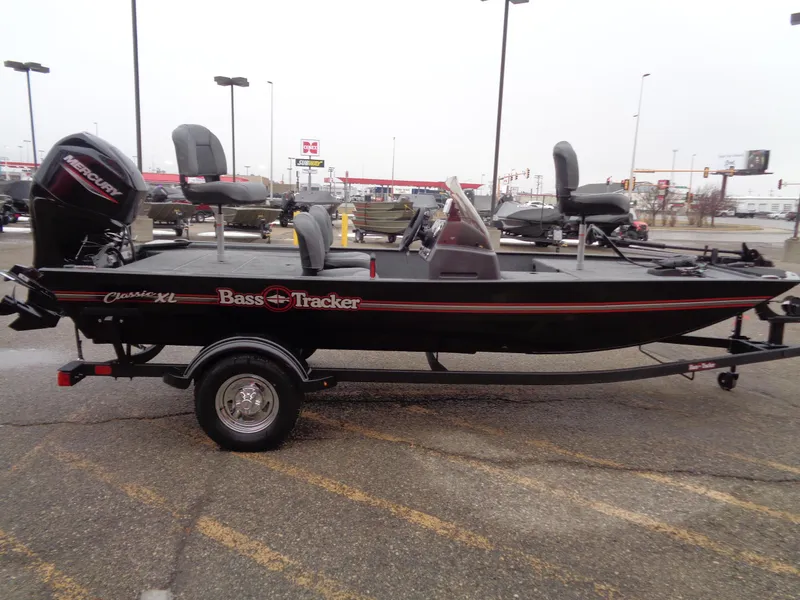 Slide: The Image of 2024 Tracker Bass Tracker Classic XL fishing boat on trailer in parking lot. - 47