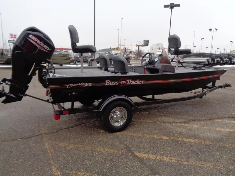 Slide: The Image of 2024 Tracker Bass Tracker Classic XL boat in parking lot. - 48