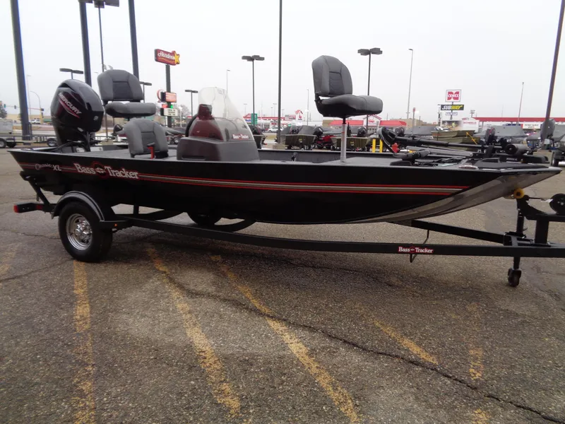 Slide: The Image of 2024 Tracker Bass Tracker Classic XL boat on trailer in parking lot. - 49