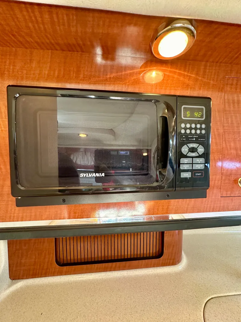 Slide: The Image of Sylvania microwave in 2003 Sea Ray 290 Amberjack boat interior. - 21