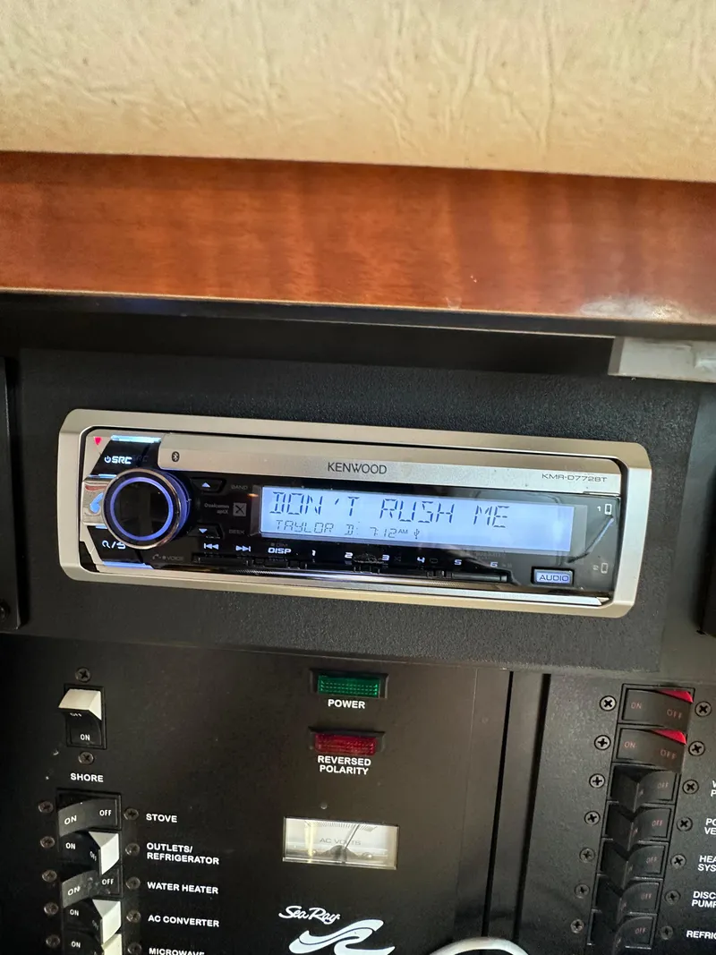 Slide: The Image of Kenwood stereo system on 2003 Sea Ray 290 Amberjack boat dashboard. - 22