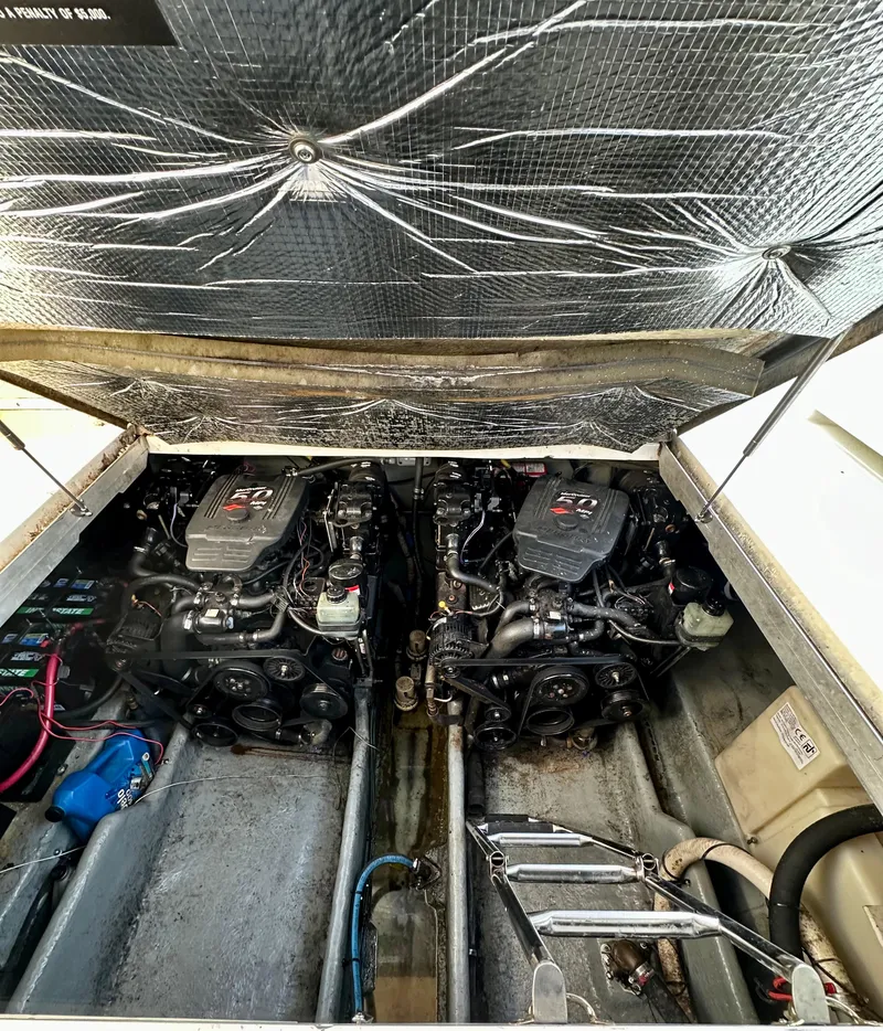 Slide: The Image of Engine compartment of a 2003 Sea Ray 290 Amberjack boat, showing dual engines. - 24