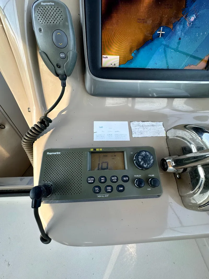 Slide: The Image of Control panel of a 2003 Sea Ray 290 Amberjack with navigation equipment. - 7