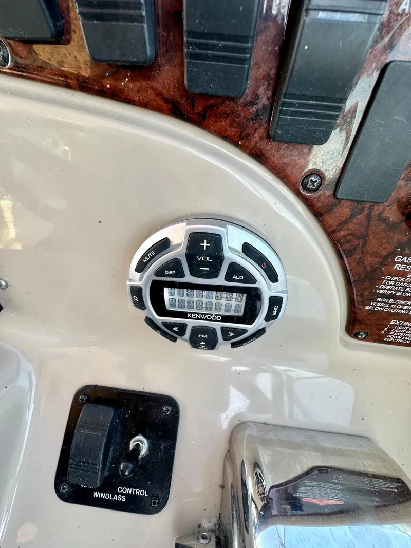 Slide: The Image of Control panel of a 2003 Sea Ray 290 Amberjack boat with audio system. - 8