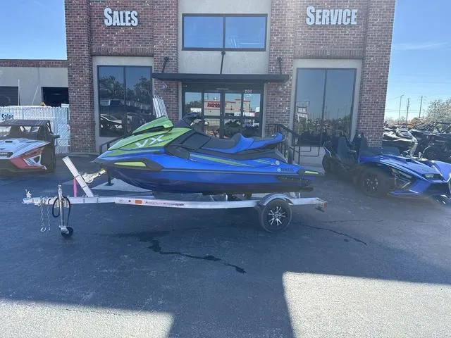 Slide: The Image of 2024 Yamaha Marine Waverunner VX Limited HO in azure blue on trailer outside dealership. - 11