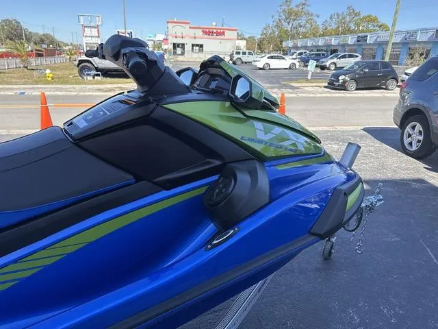 Slide: The Image of 2024 Yamaha Marine Waverunner VX Limited HO in azure blue and green, featuring advanced controls. - 4