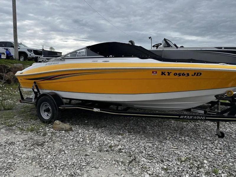 The Image of 2008 Four Winns 200 Horizon boat in yellow on a trailer. - 0
