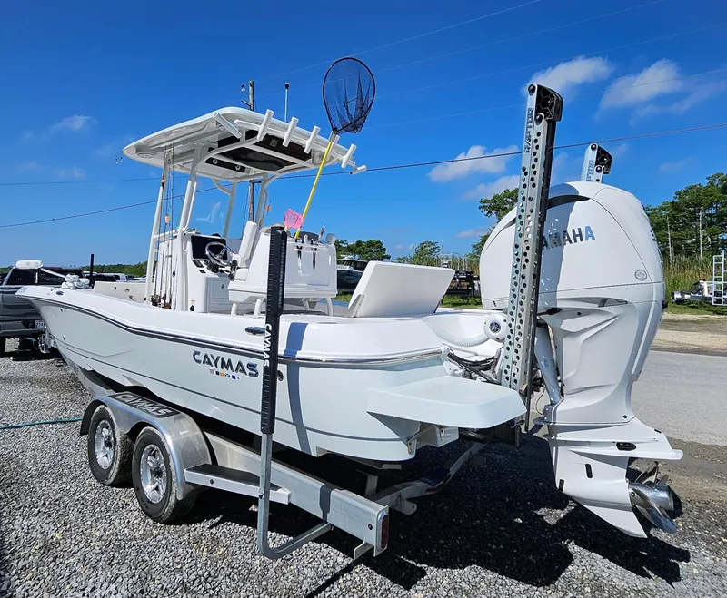 Slide: The Image of 2024 Caymas 26HB boat on trailer with Yamaha outboard motor. - 3