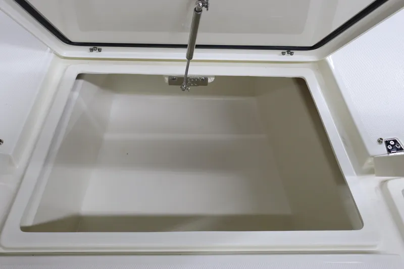 Slide: The Image of 2024 Pathfinder 2200 TRS storage compartment with open lid. - 26