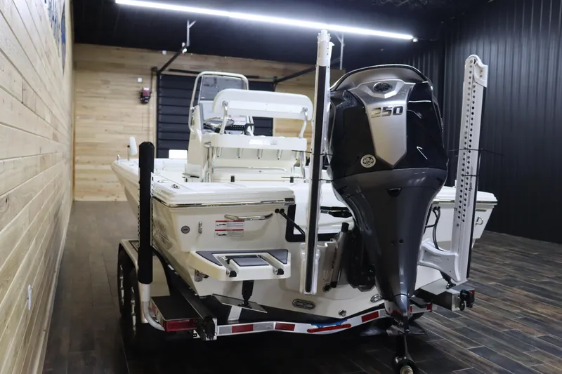 Slide: The Image of 2024 Pathfinder 2200 TRS boat with 250 HP engine in indoor showroom. - 5