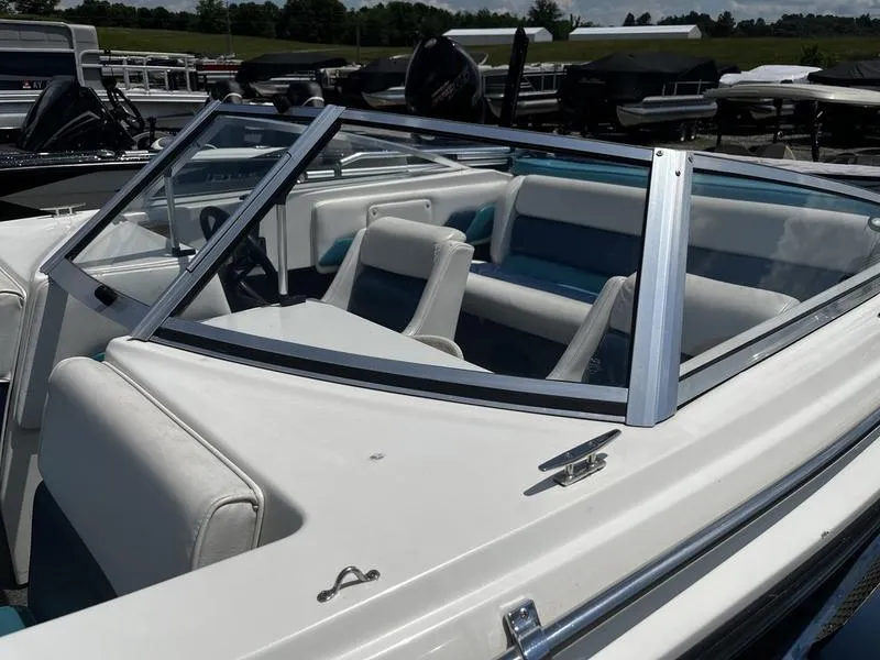 Slide: The Image of 1989 Baja SUNSPORT 174 boat interior with white and blue seating. - 1