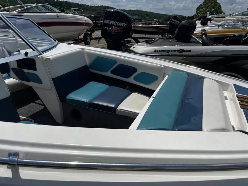 Slide: The Image of 1989 Baja SUNSPORT 174 boat interior with blue and white seating. - 5