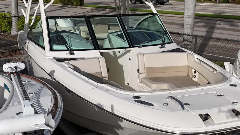 Slide: The Image of 2016 Boston Whaler 320 Vantage boat with open bow seating, docked on a sunny day. - 19
