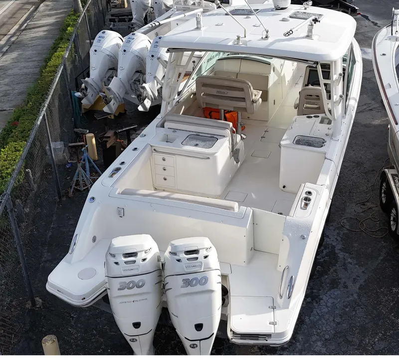 Slide: The Image of 2016 Boston Whaler 320 Vantage boat with twin 300 horsepower engines. - 2